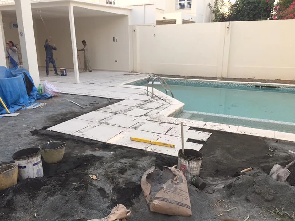 Poolside tiling and construction work in progress